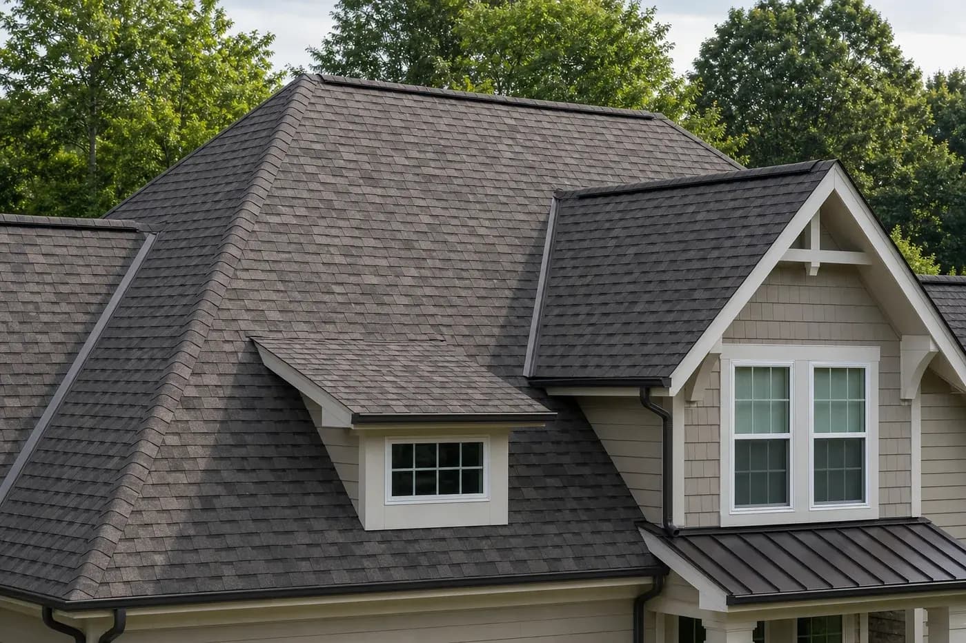 Charlotte NC home roof with architectural asphalt shingles and metal roof accents under mature trees