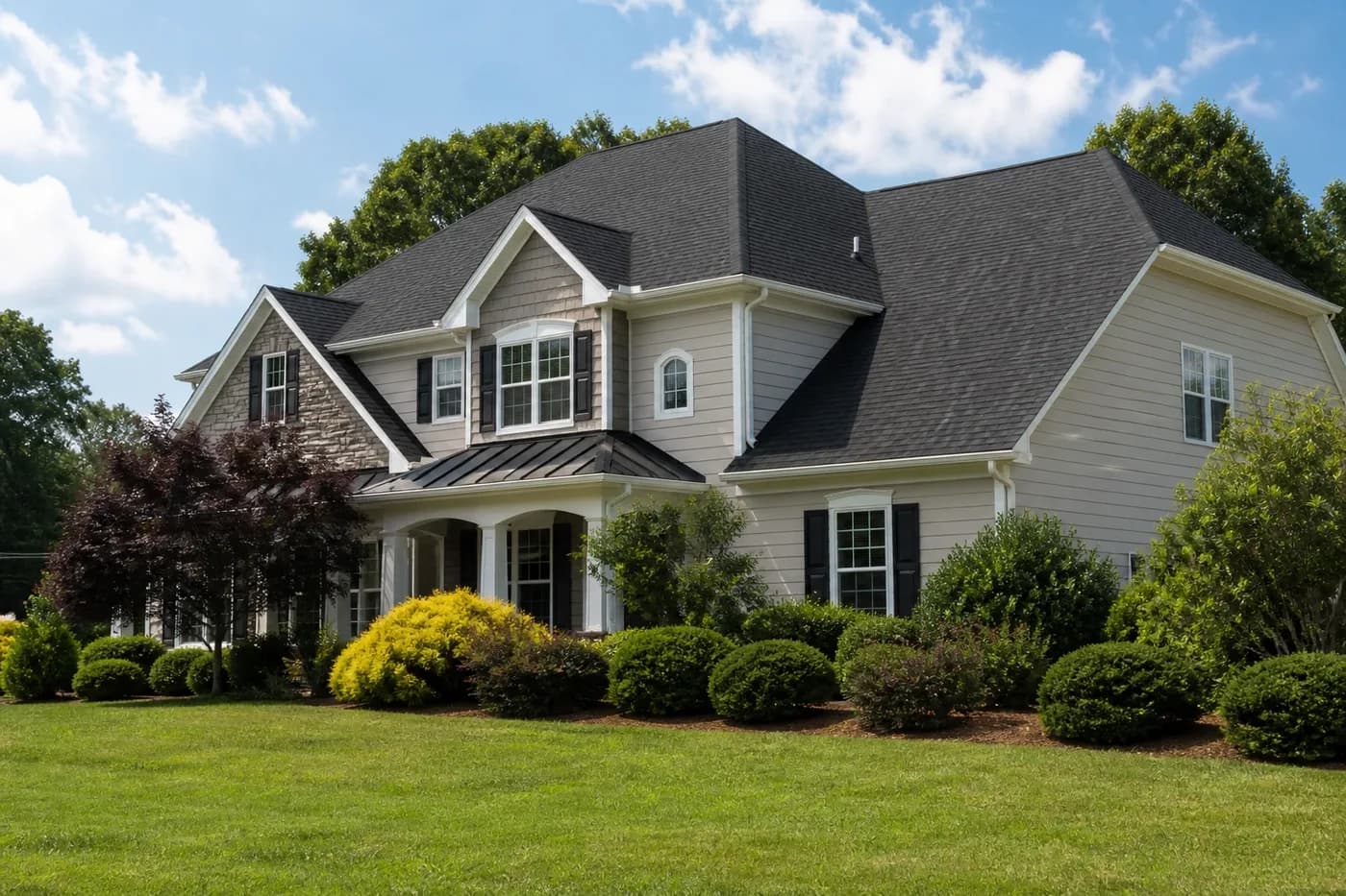 Roof-dominant upscale Indian Trail NC home with clean white fascia, soffits, and gutters