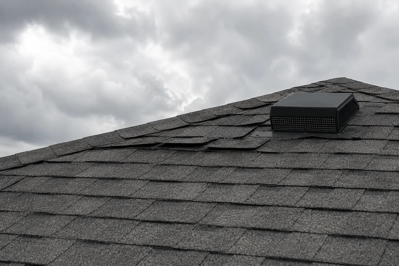 Indian Trail NC asphalt shingle roof with lifted tabs after wind and rain