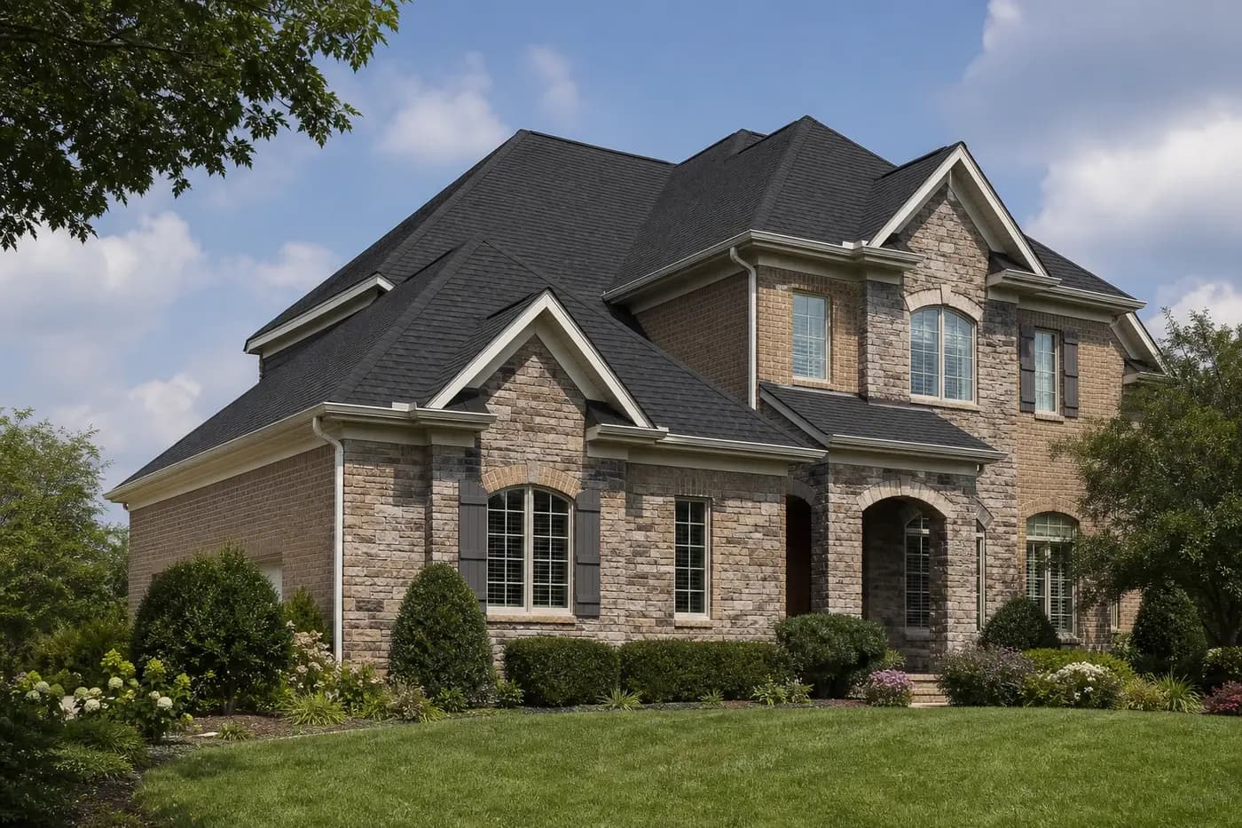 Roof-dominant upscale Indian Trail NC home with architectural shingles and clean white gutters