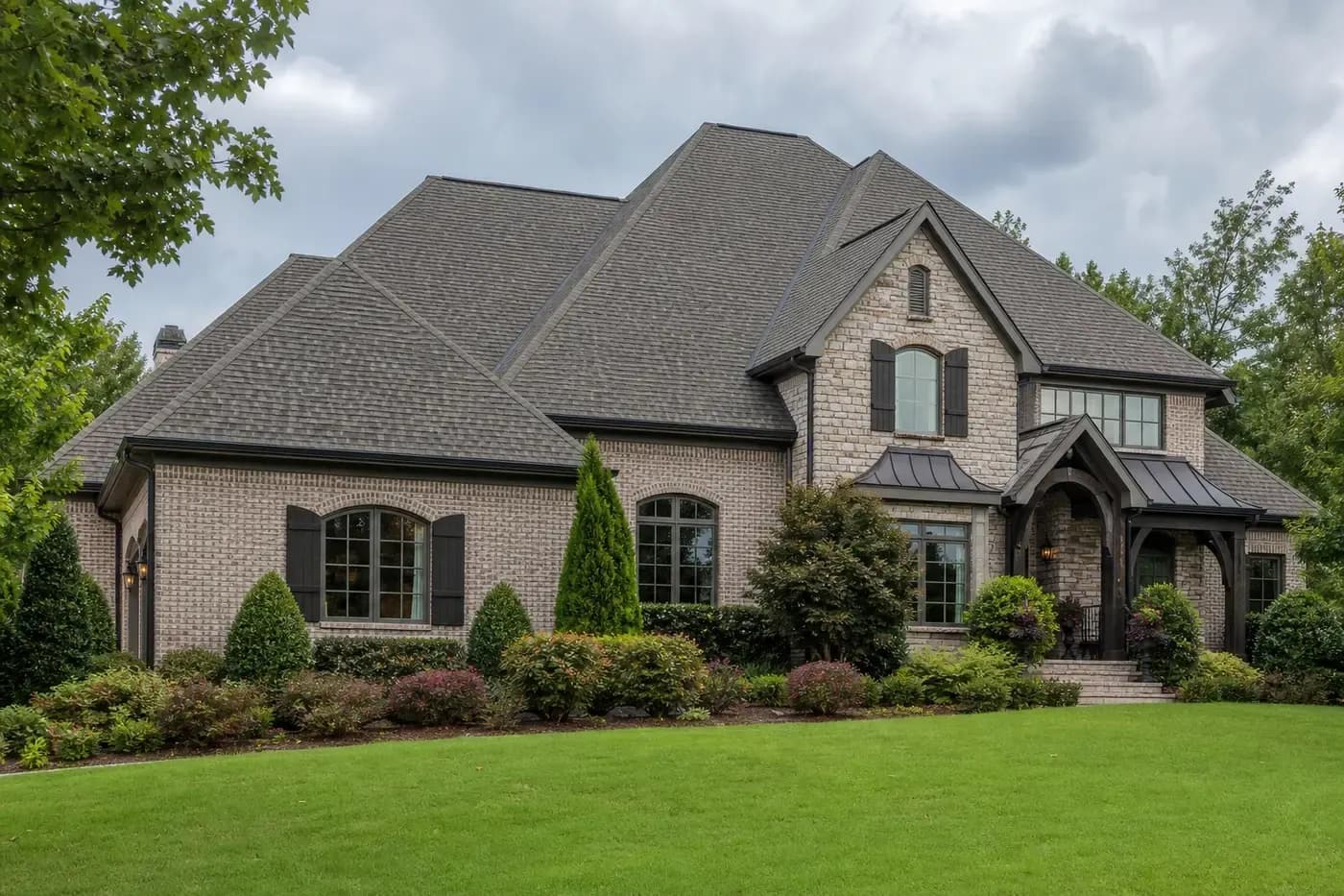 High-end Charlotte NC home with a normal architectural asphalt shingle roof showing realistic shingle texture