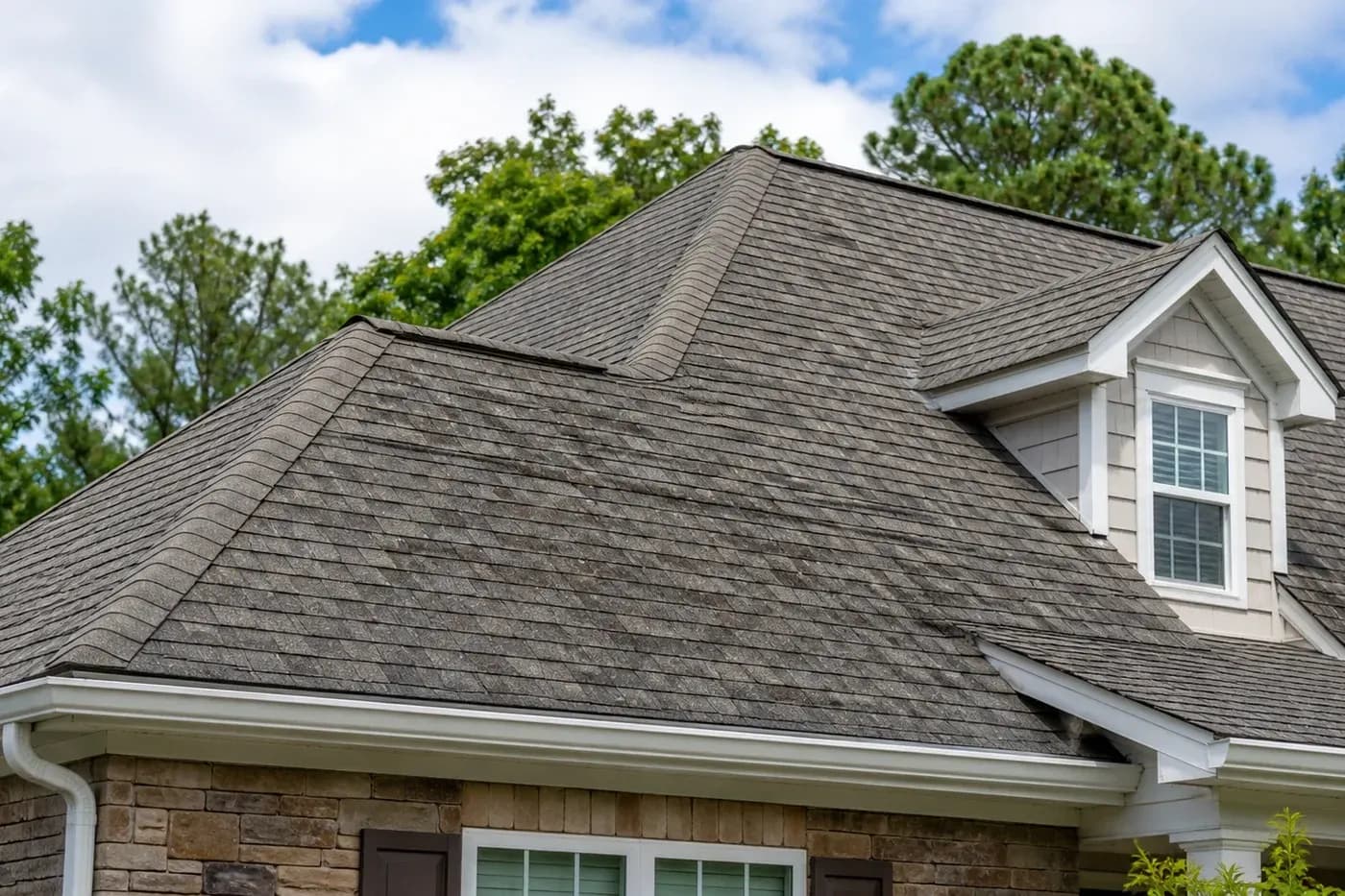 Charlotte NC home roof with aging asphalt shingles and no people, ladders, tools, vehicles, or equipment visible