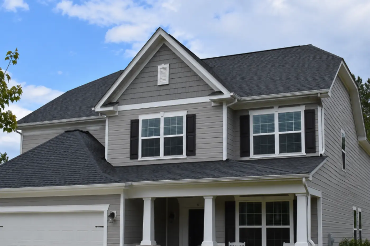 Indian Trail NC two-story home with a dark asphalt shingle roof and clean roof-to-wall transitions