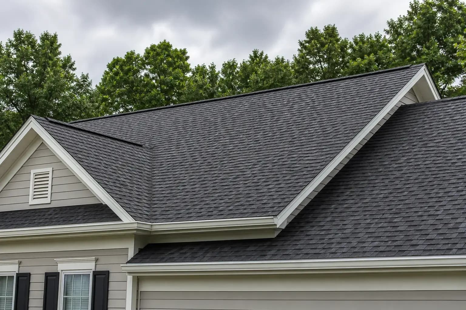 Charlotte NC asphalt shingle roof with wind-lifted shingles after a summer storm