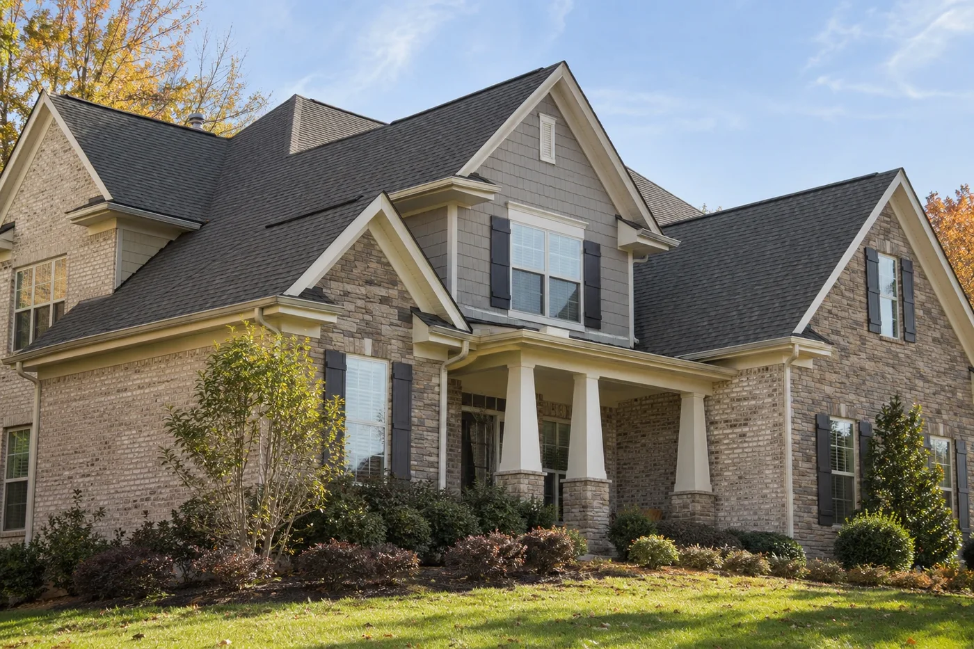 Representative upscale Indian Trail home with a prominent charcoal shingle roof, ridge vents, soffits, and coherent roof planes