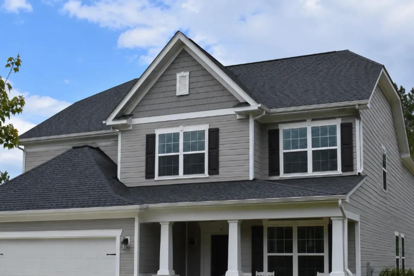 Representative Indian Trail home with a prominent charcoal architectural-shingle roof being evaluated for repairability