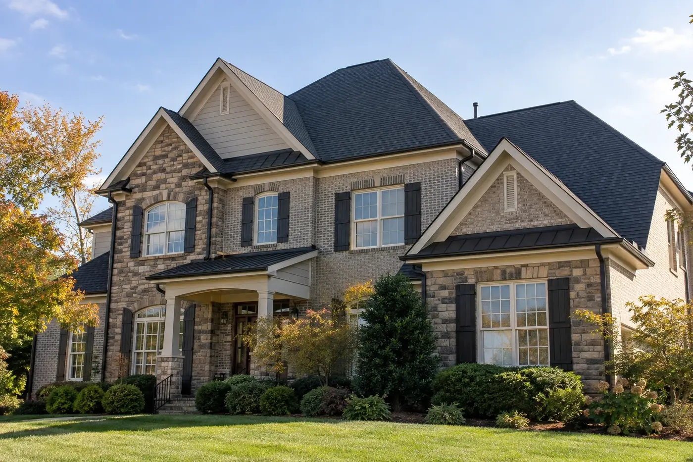 Representative upscale Indian Trail home with a prominent charcoal architectural-shingle roof