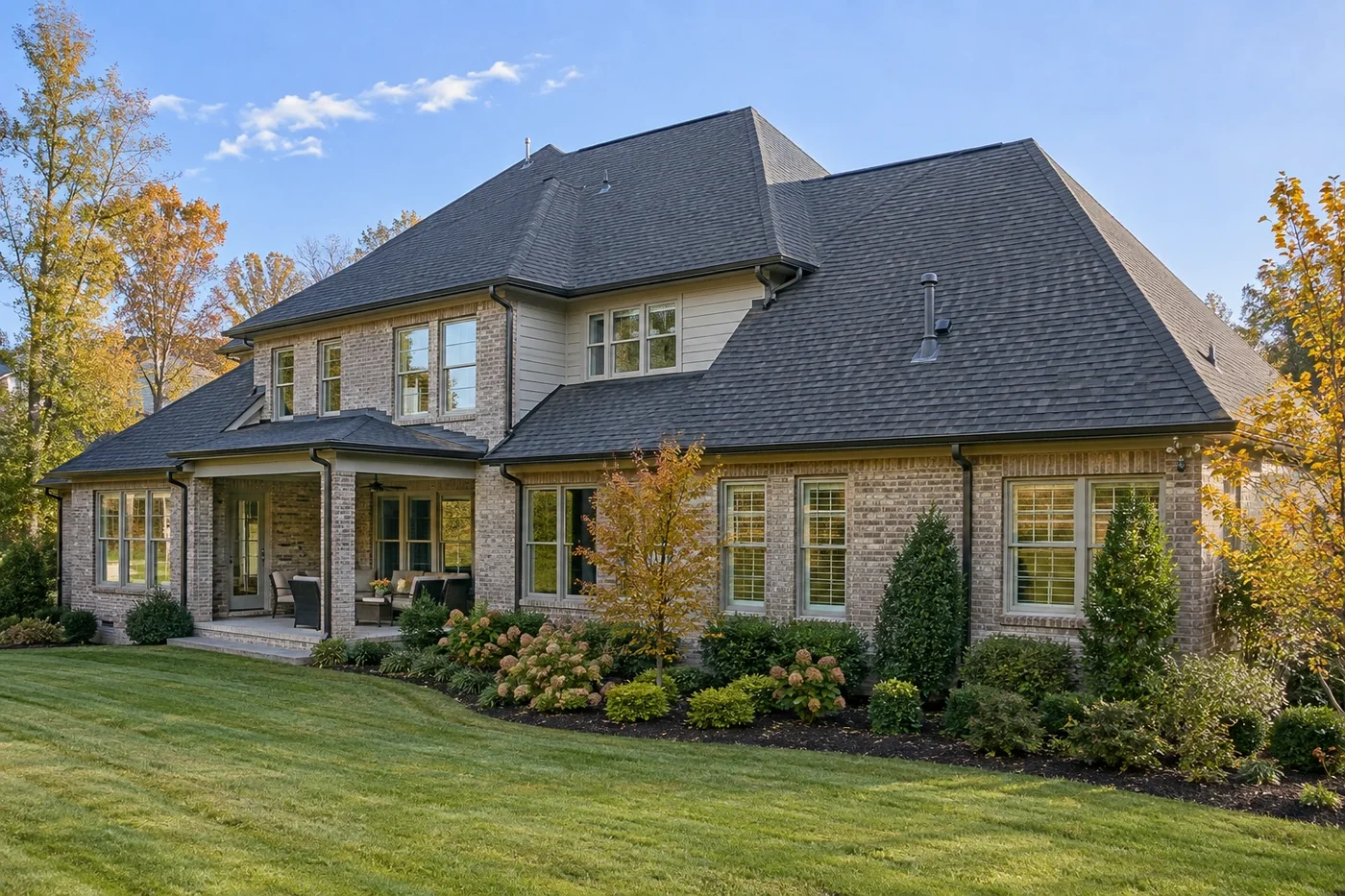 Representative upscale Indian Trail home with a prominent clean charcoal architectural-shingle roof