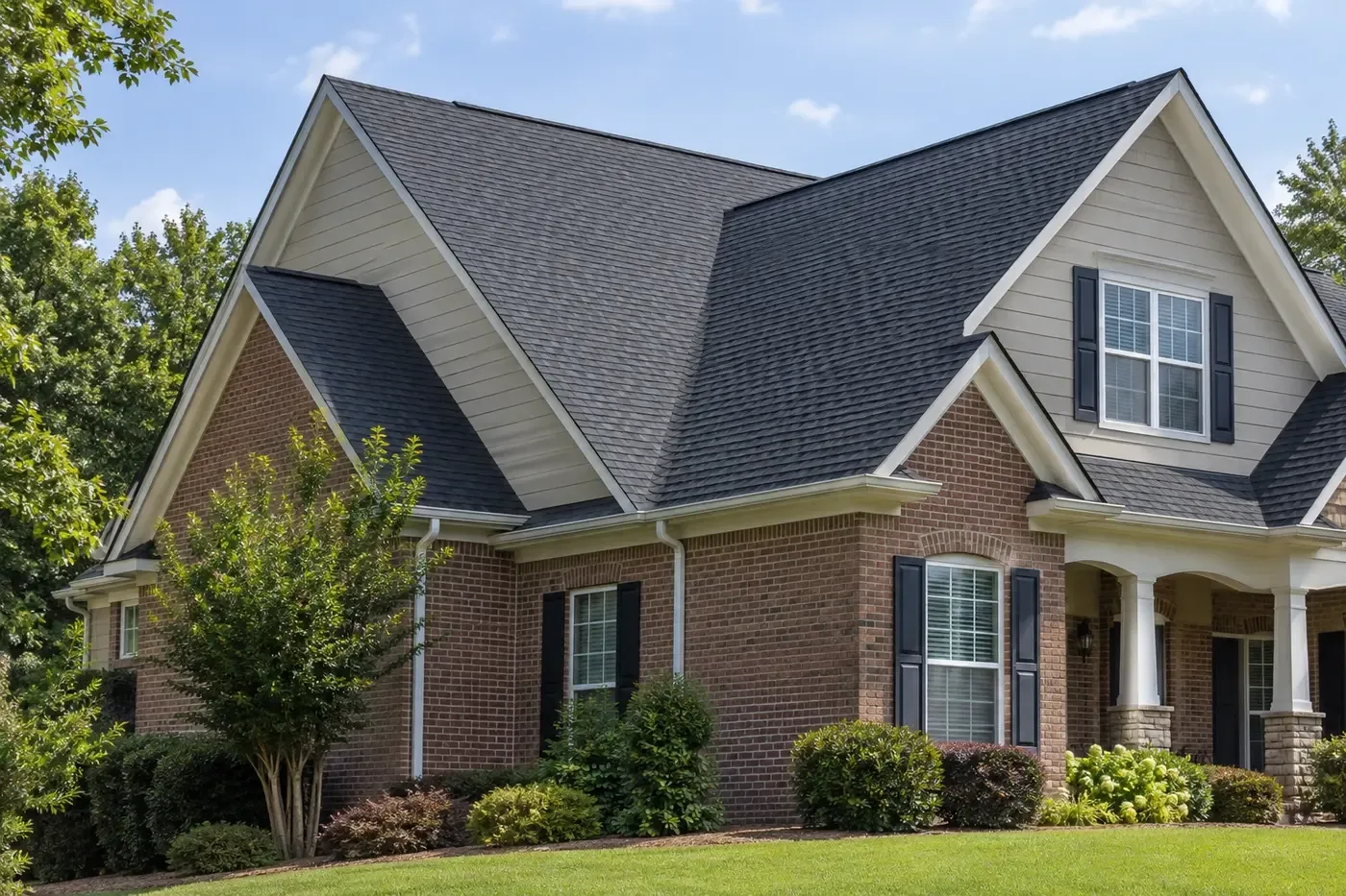 Representative Indian Trail home with a coherent charcoal shingle roof and clearly visible white gable rake edges