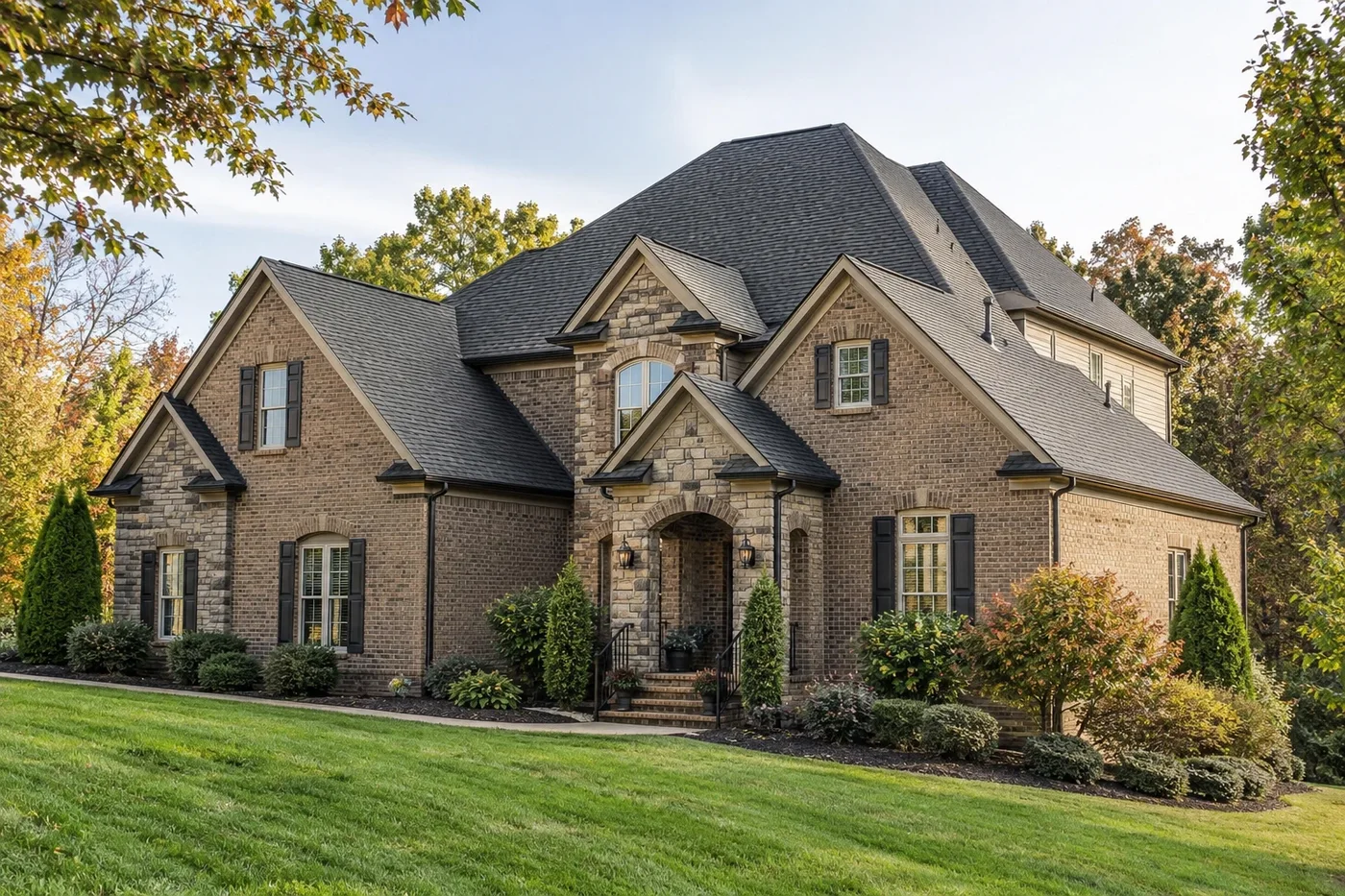 Representative upscale Indian Trail home with a prominent clean charcoal architectural-shingle roof